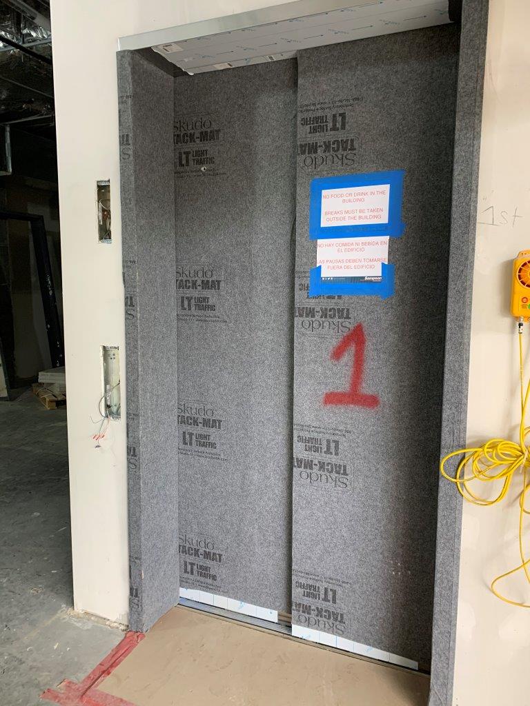 Door tack mat impact protection during construction