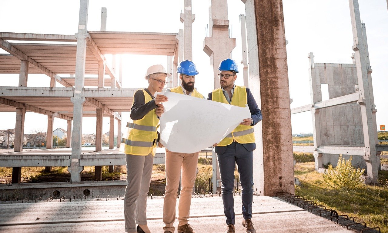 Construction workers planning a project using surface protection products from SkudoUSA