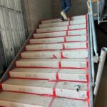 SkudoBoard Stair Guard protecting concrete stairs on a jobsite