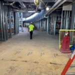 Construction worker walking over Skudo HT Commercial System